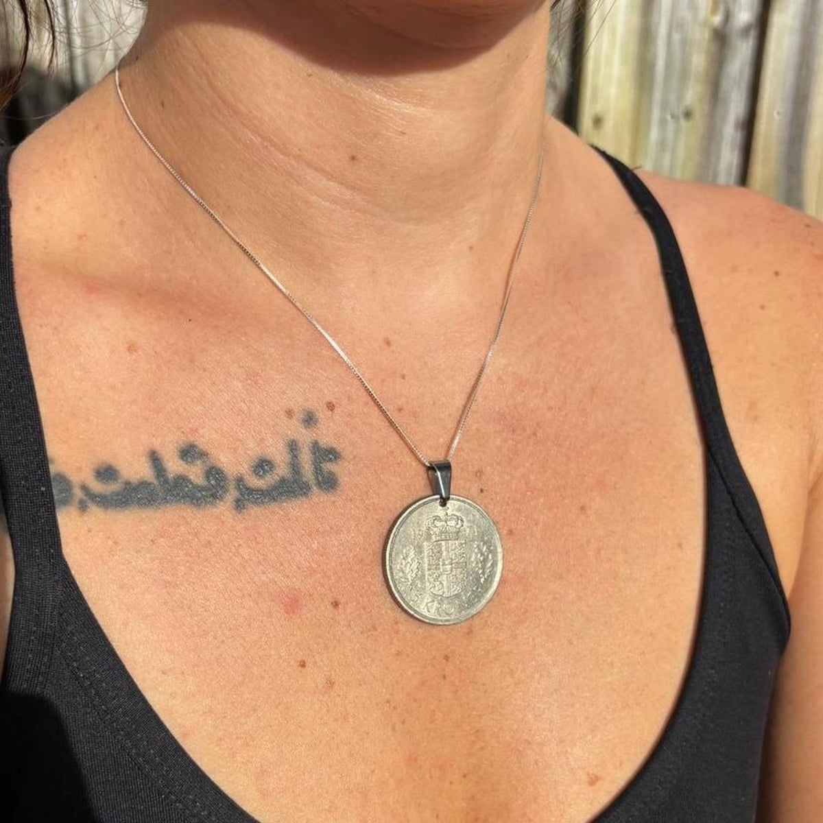 Silver coin pendant necklace with