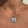 Handmade coin necklace displaying a